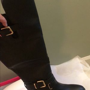 Beautiful Knee High Black Boots. Never been worn.
